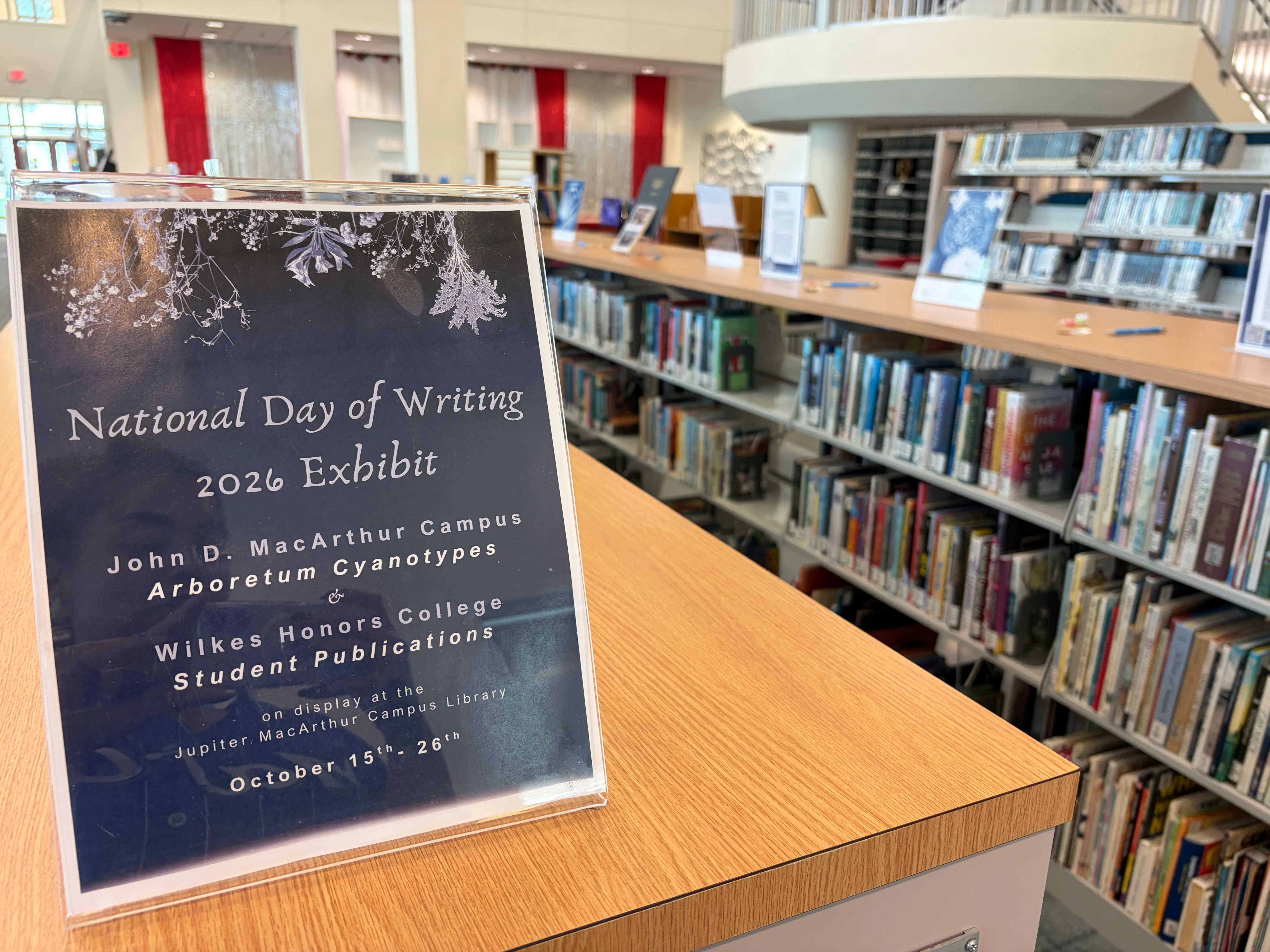 National Day of Writing 2026 exhibit sign for Arboretum Cyanotypes in a library